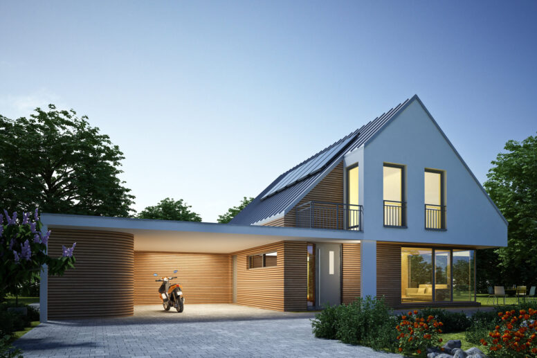Modernes Haus mit Zinkdach und beleuchtetem Carport